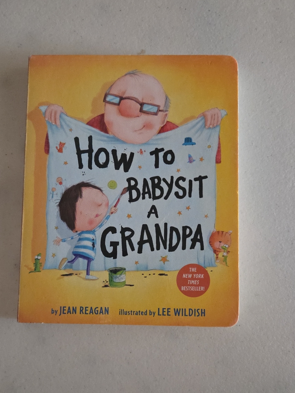 How to Babysit a Grandpa - Illustrated Children's Board Book (Yellow, Blue)